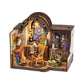 Assembled miniature room on a bookshelf for scale