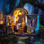 The Wizard's Study miniature room kit, fully assembled with the lamp on