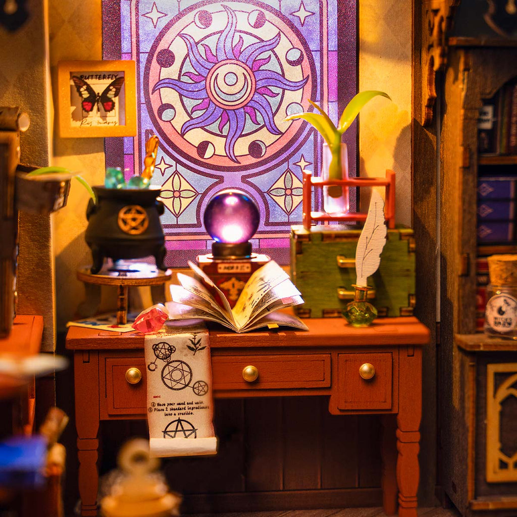 Wizard's workbench with books and crystal ball in miniature