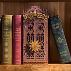 Witch's chair, cauldron and black cat inside the book nook