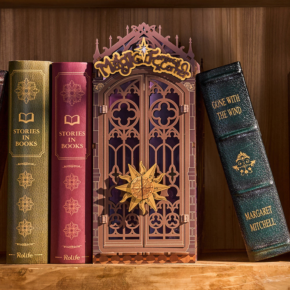 Witch's chair, cauldron and black cat inside the book nook