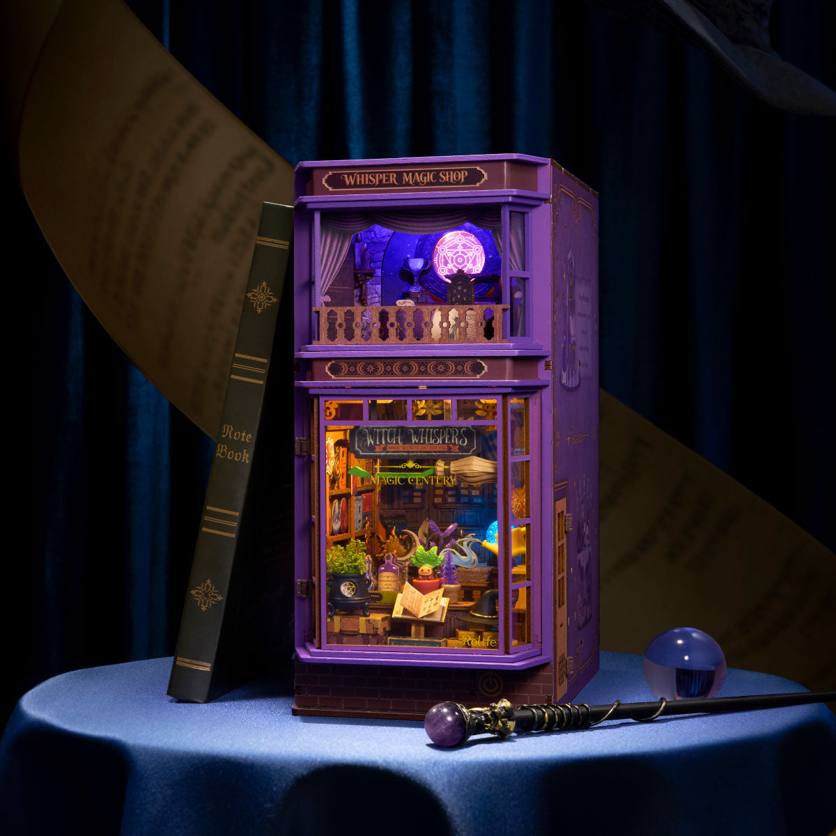 The Whisper Shop magic book nook, fully assembled with lights on