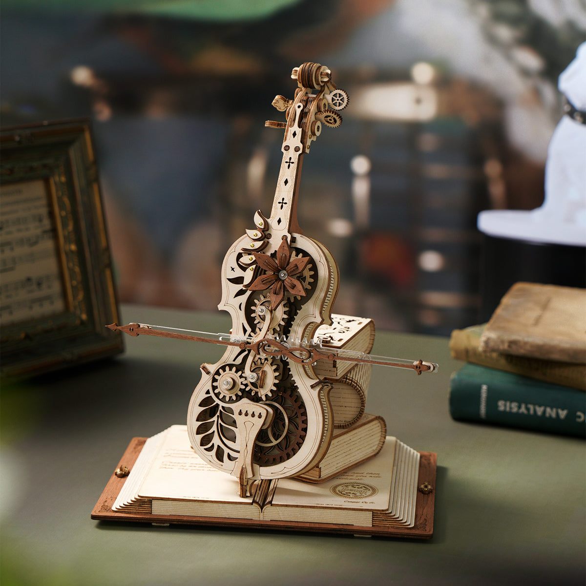 Acrylic bow on the natural wood cello music box, mid-travel